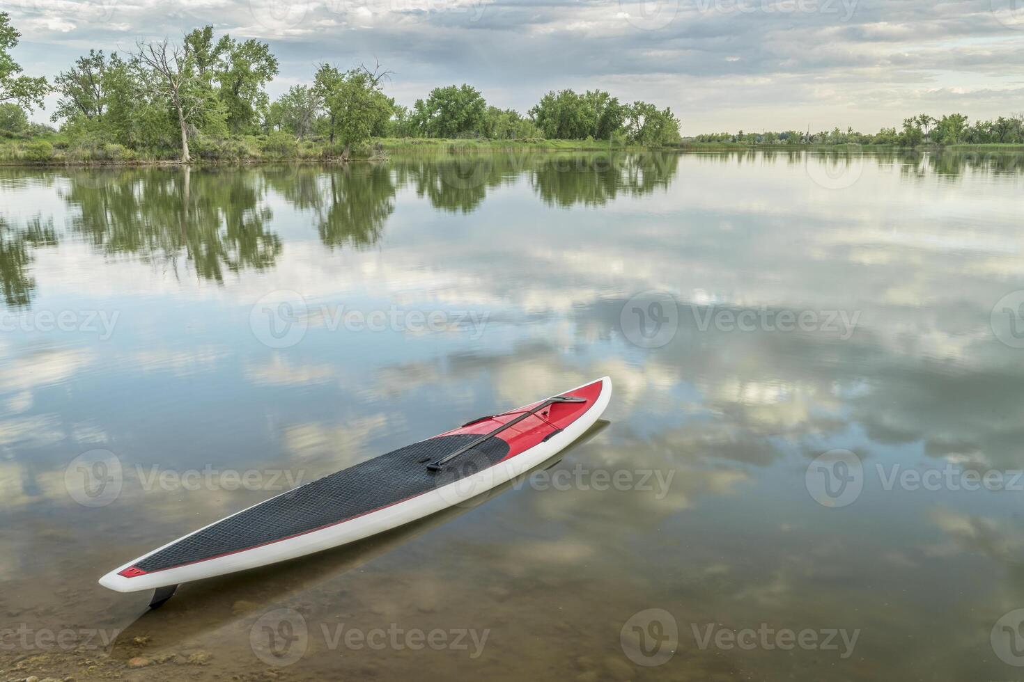 stand up paddleboard on lake photo