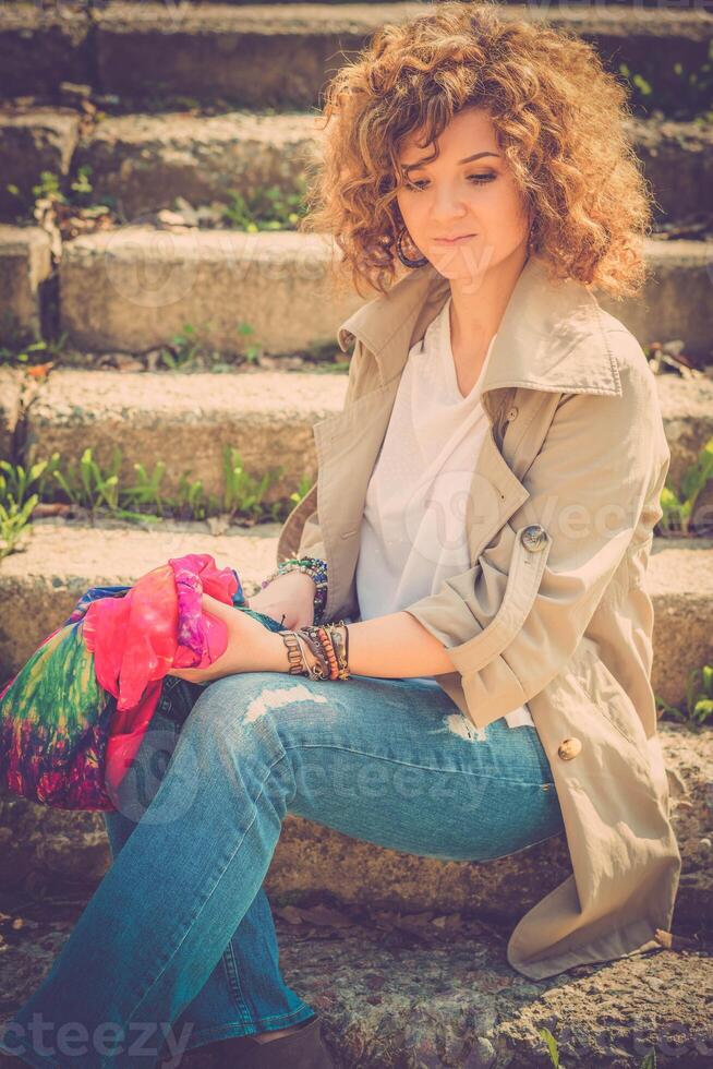 Fashion shot of a beautiful boho style girl on nature background. Boho, hippie. photo