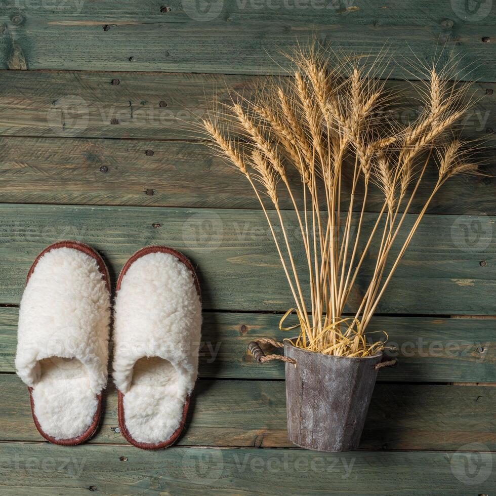 White slippers on the wooden background. Beauty and fashion. photo