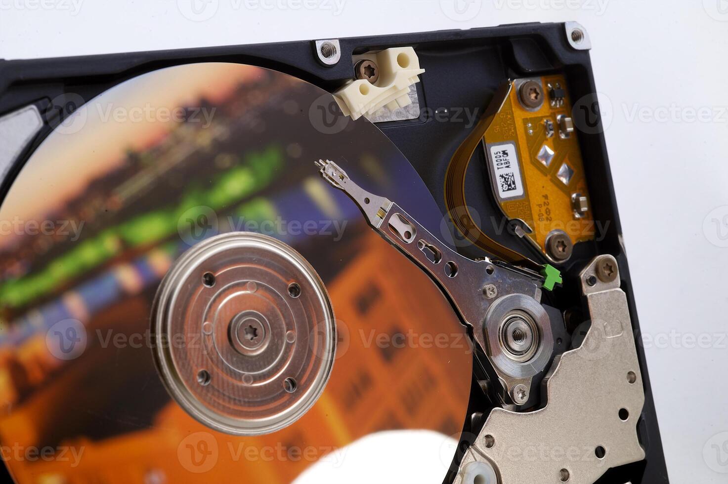 Close-up inside view of hard disk isolated on white background photo