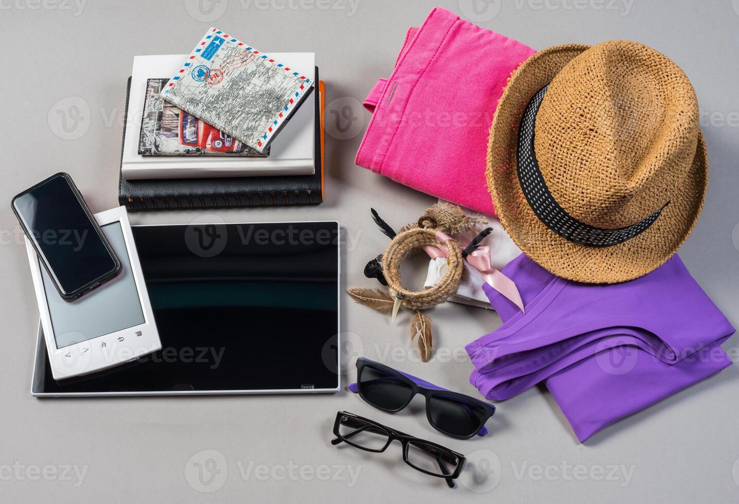 Mock up of summer traveling stuff on grey background. photo