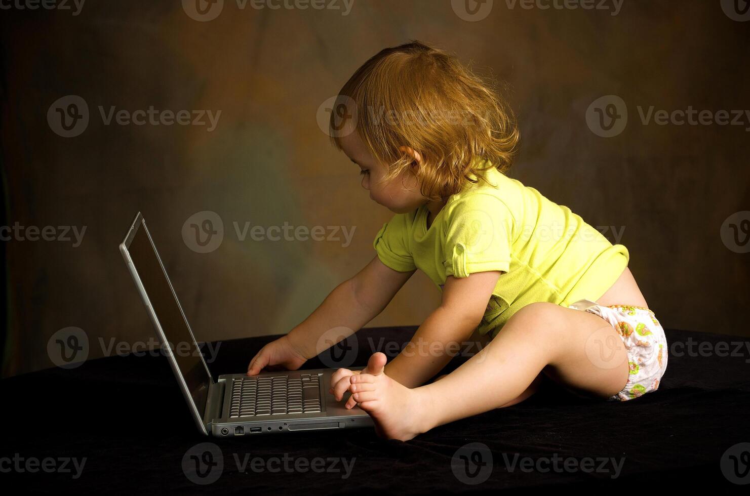 Small girl works with the computer photo