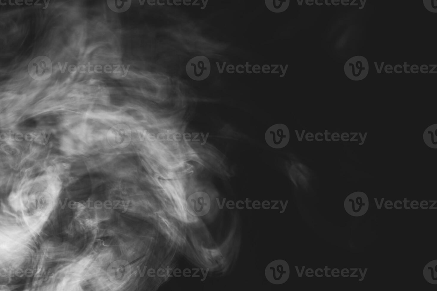 White smoke isolated on black background photo