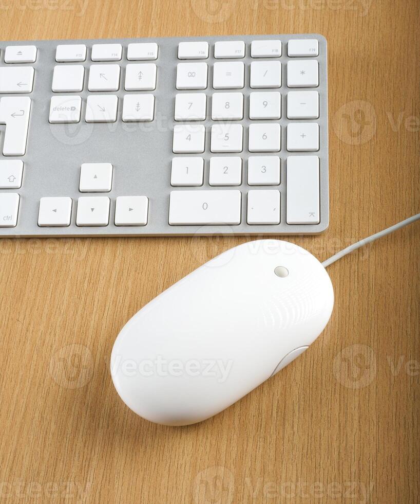 Modern aluminum computer keyboards and mouse for computer photo
