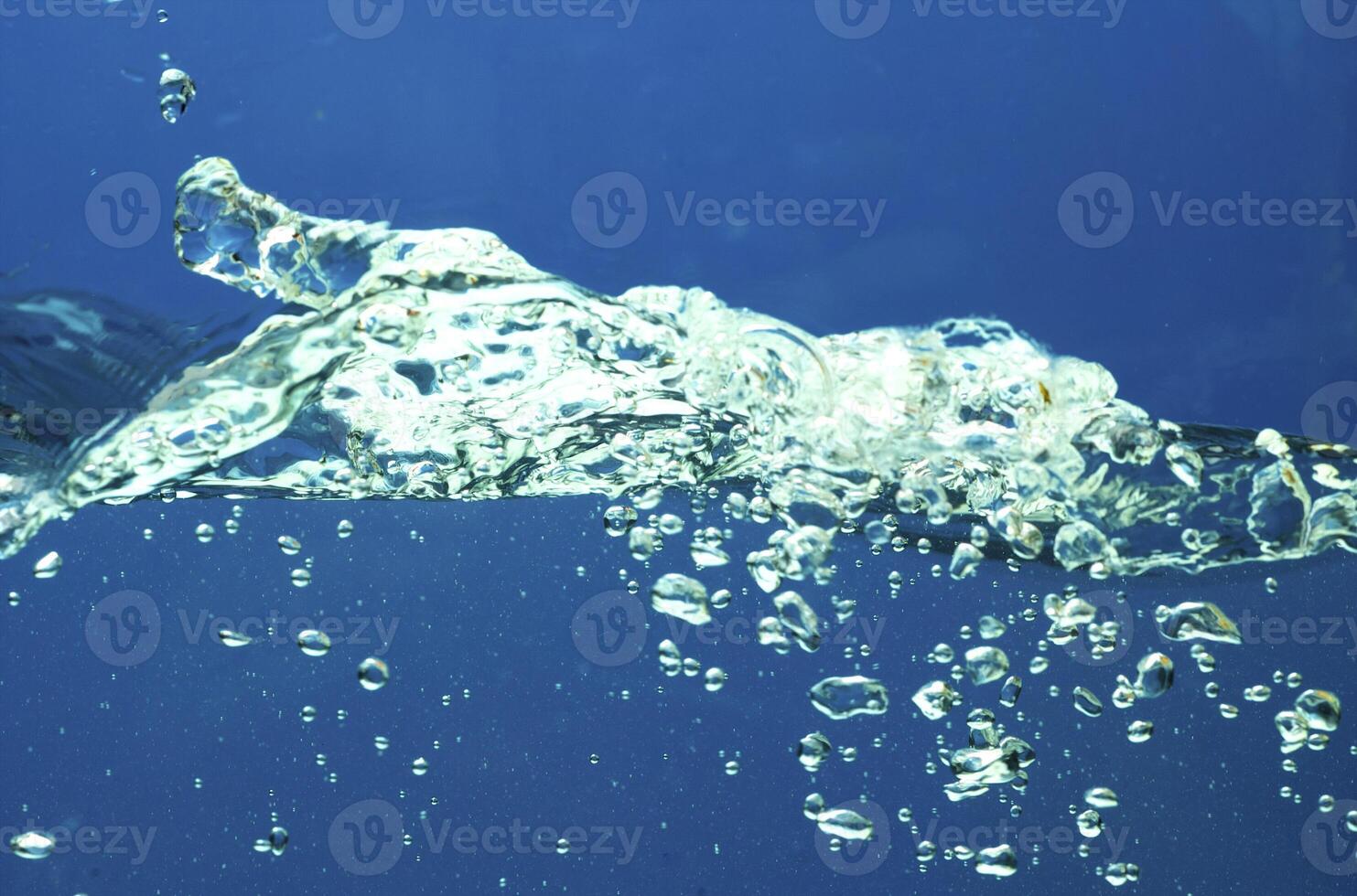 Fresh water with waves and bubbles photo