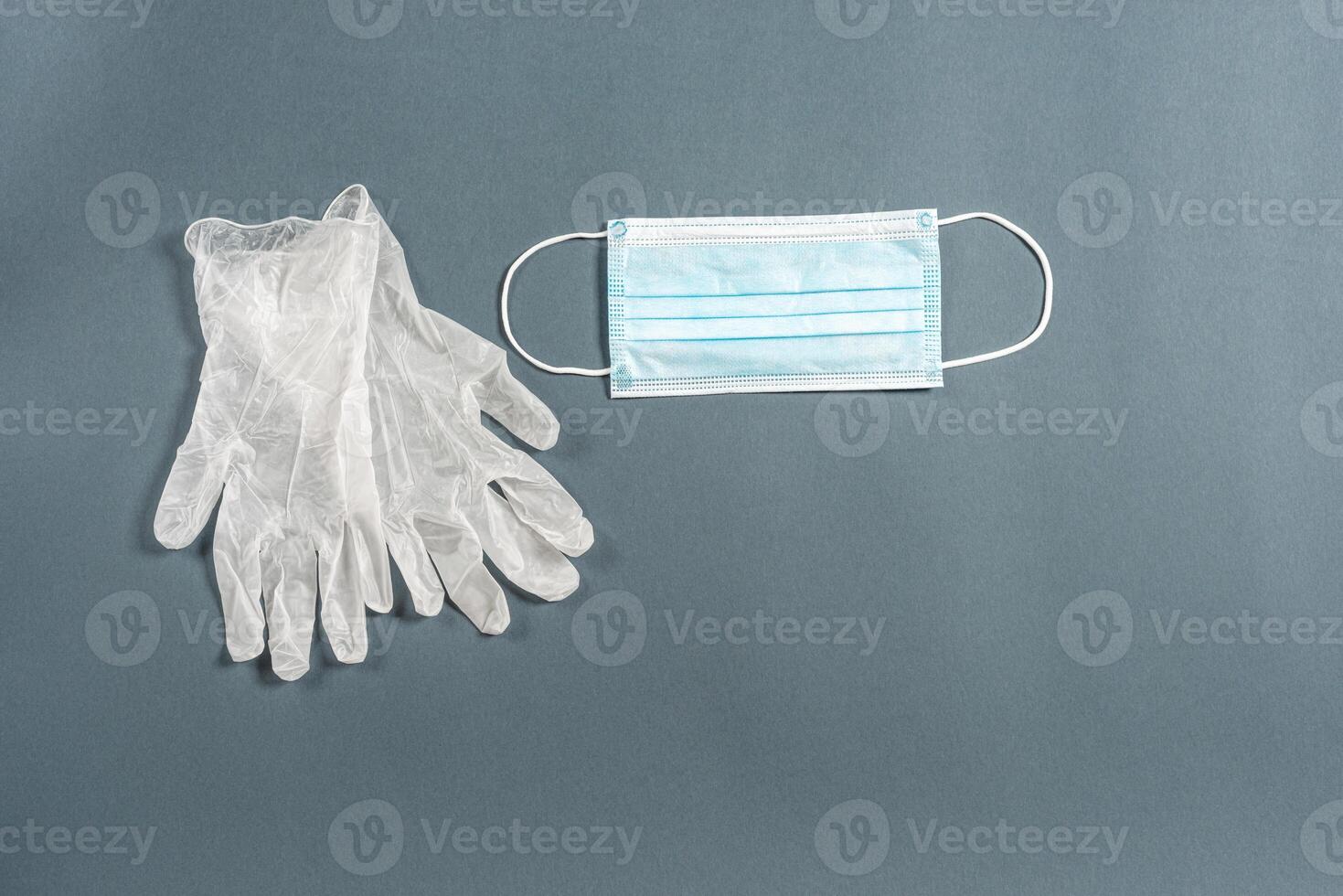 Disposable rubber medical gloves and mask. photo