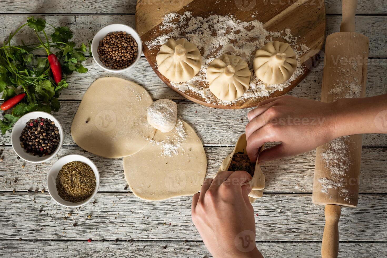 Georgian khinkali on wooden background photo