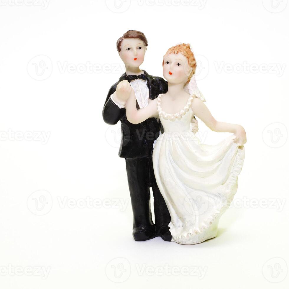 Figurines on top of wedding cake photo