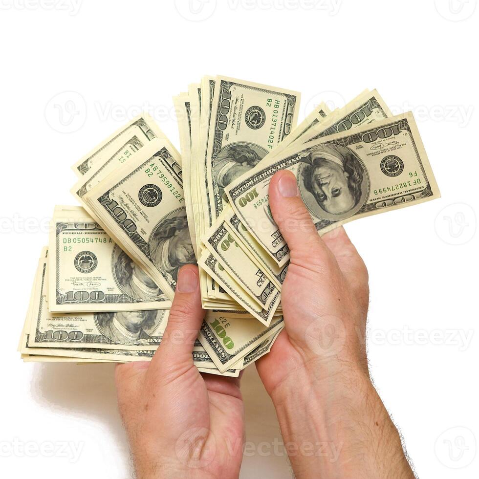American dollars arranged in stacks of 100 bills each photo