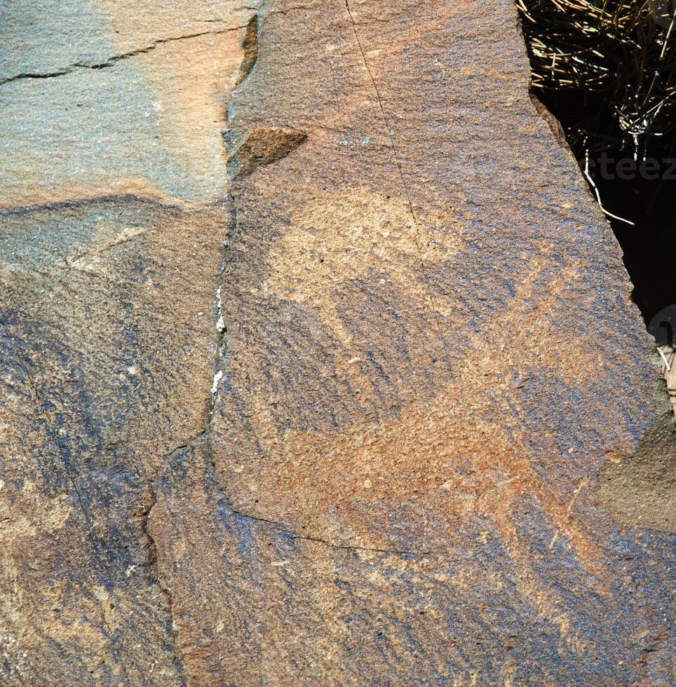 Petroglyphs within the Archaeological Landscape of Tamgaly. Almaty area, Kazakhstan photo