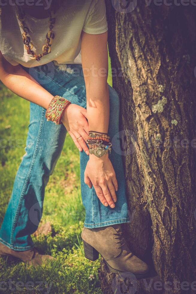 Fashion shot of a beautiful boho style girl on nature background. Boho, hippie. photo
