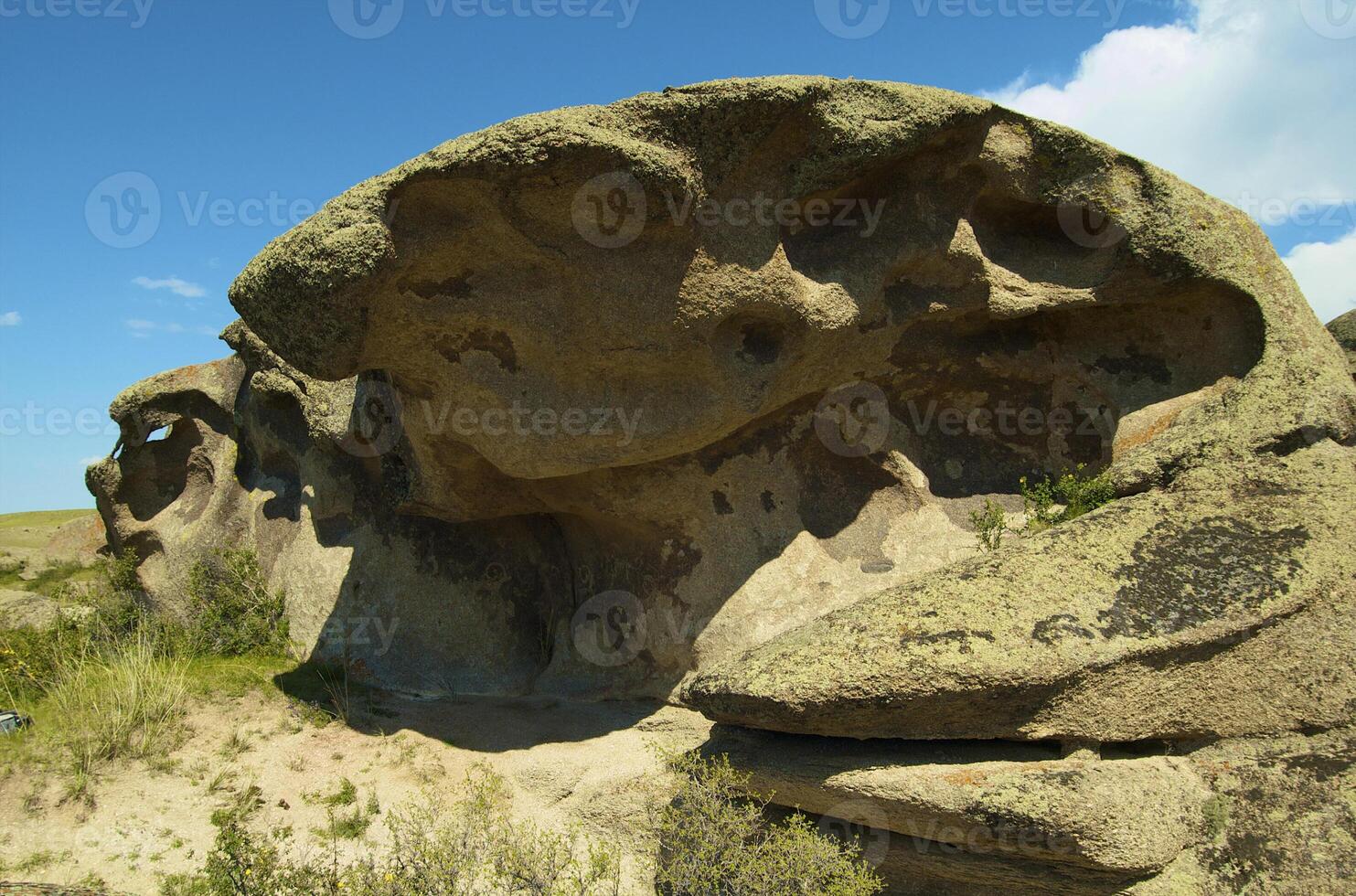 Ancient figures on the the stone photo