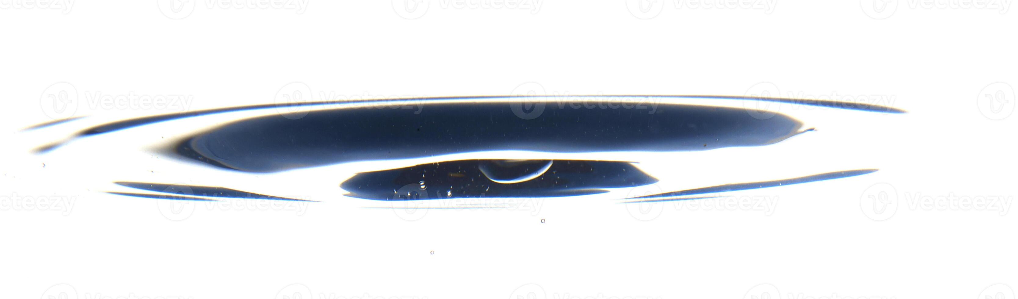 The round transparent drop of water, falls downwards photo