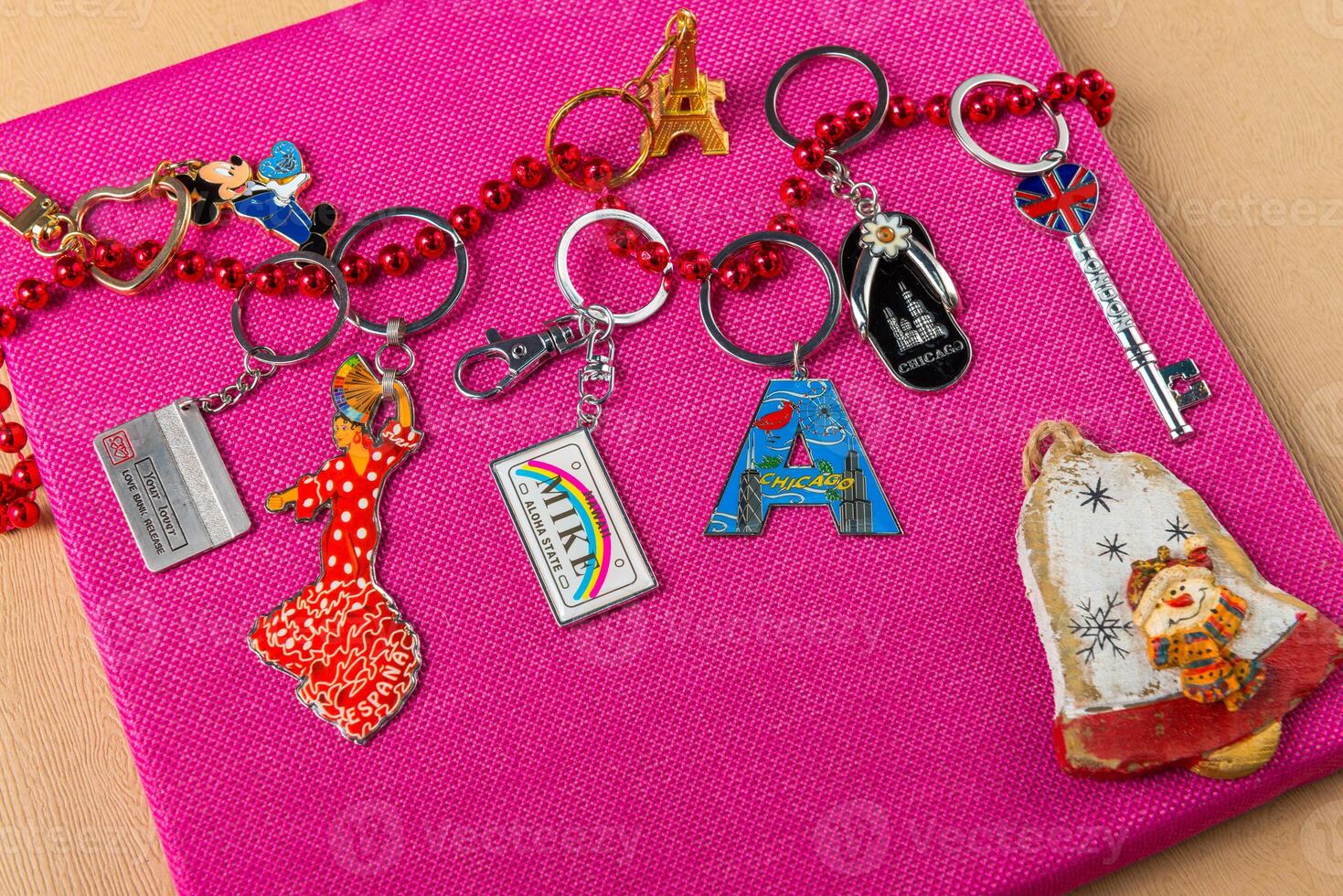 Souvenirs keychains from different cities of the world photo