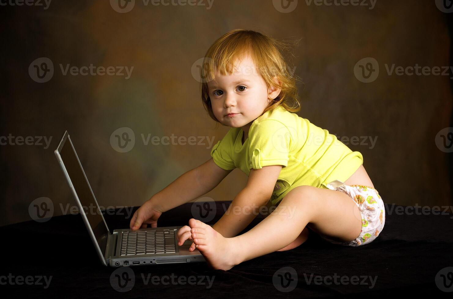 Small girl works with the computer photo