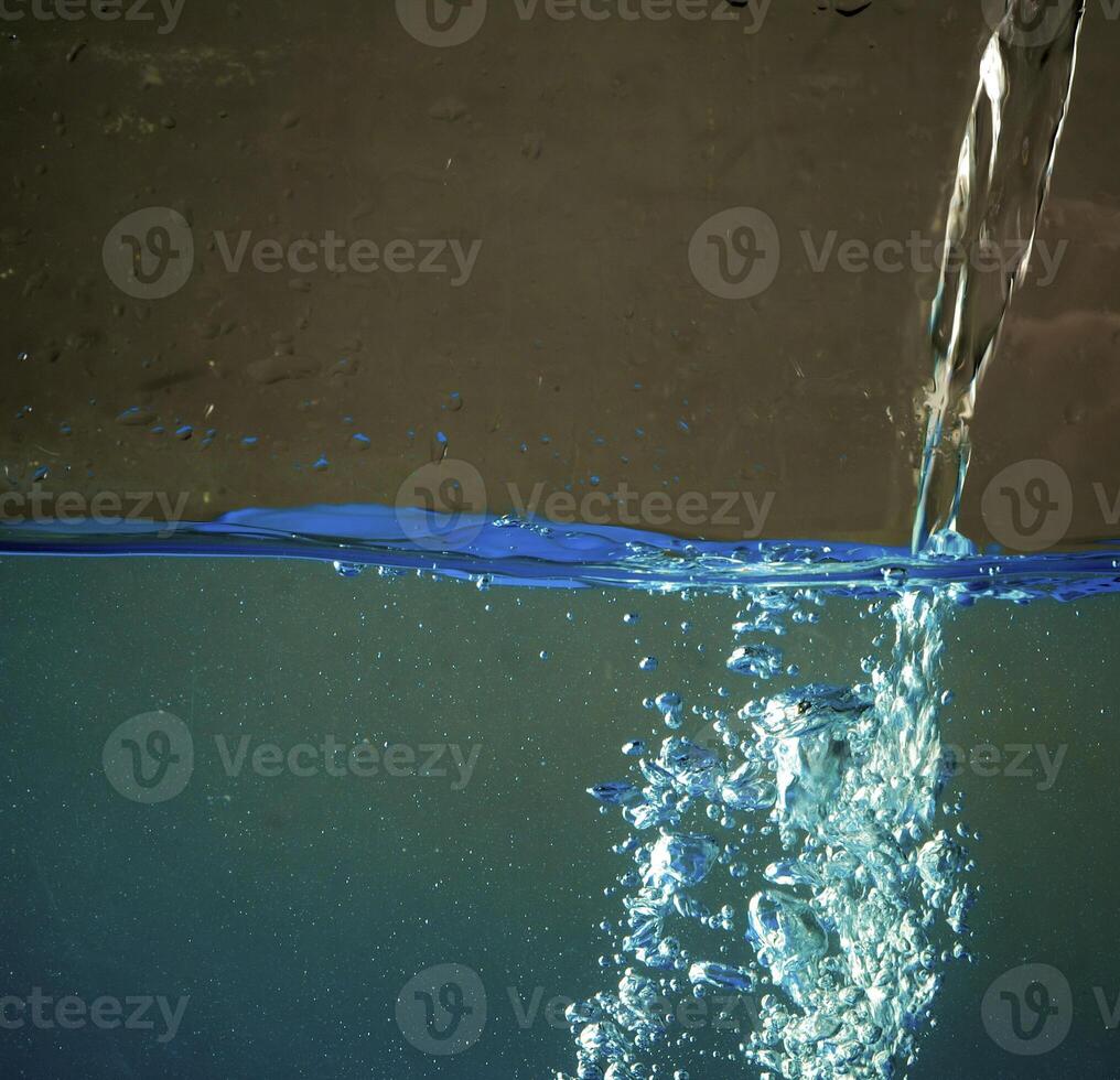 Fresh water with waves and bubbles photo