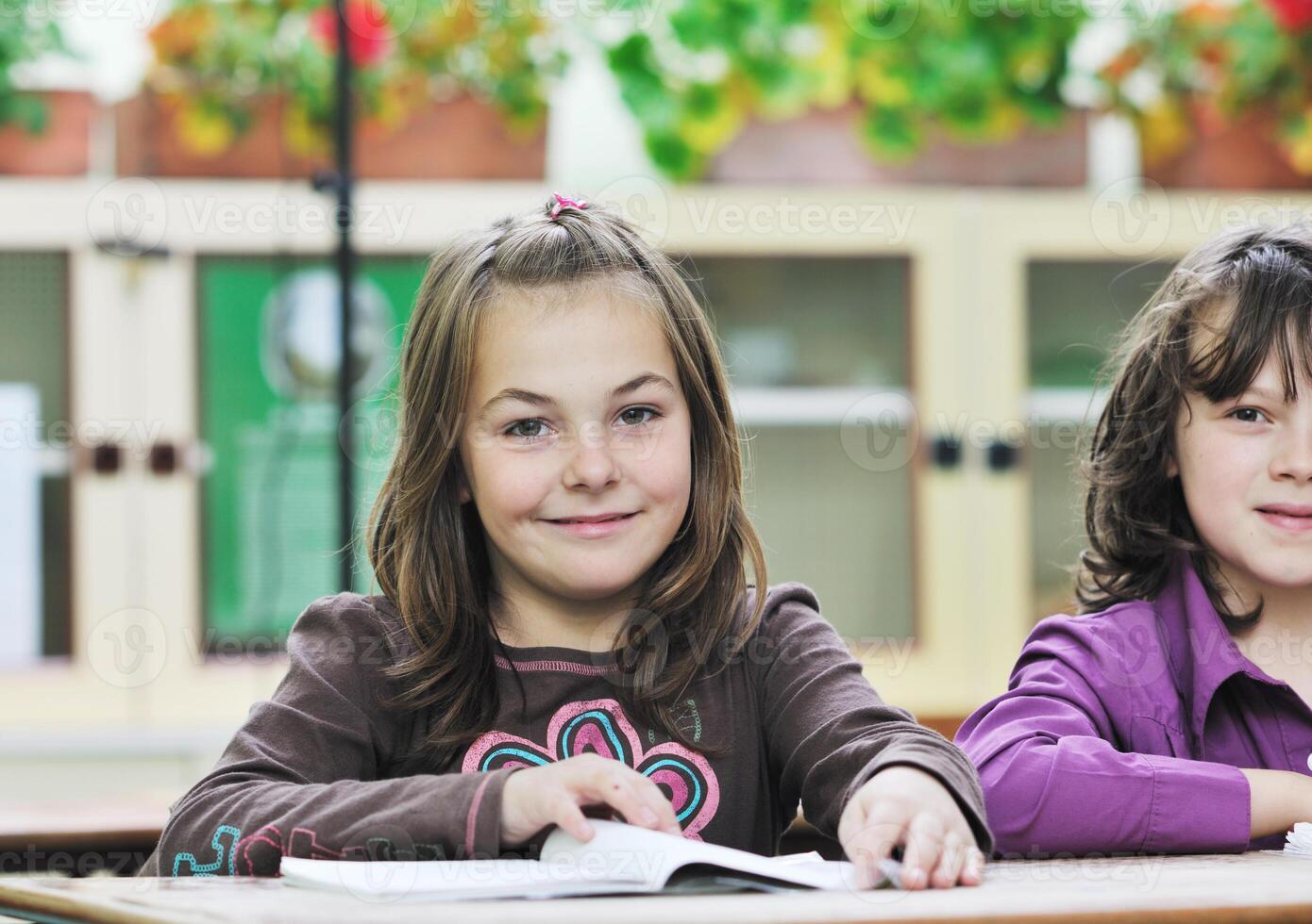 happy child  in schoold have fun and learning leassos photo