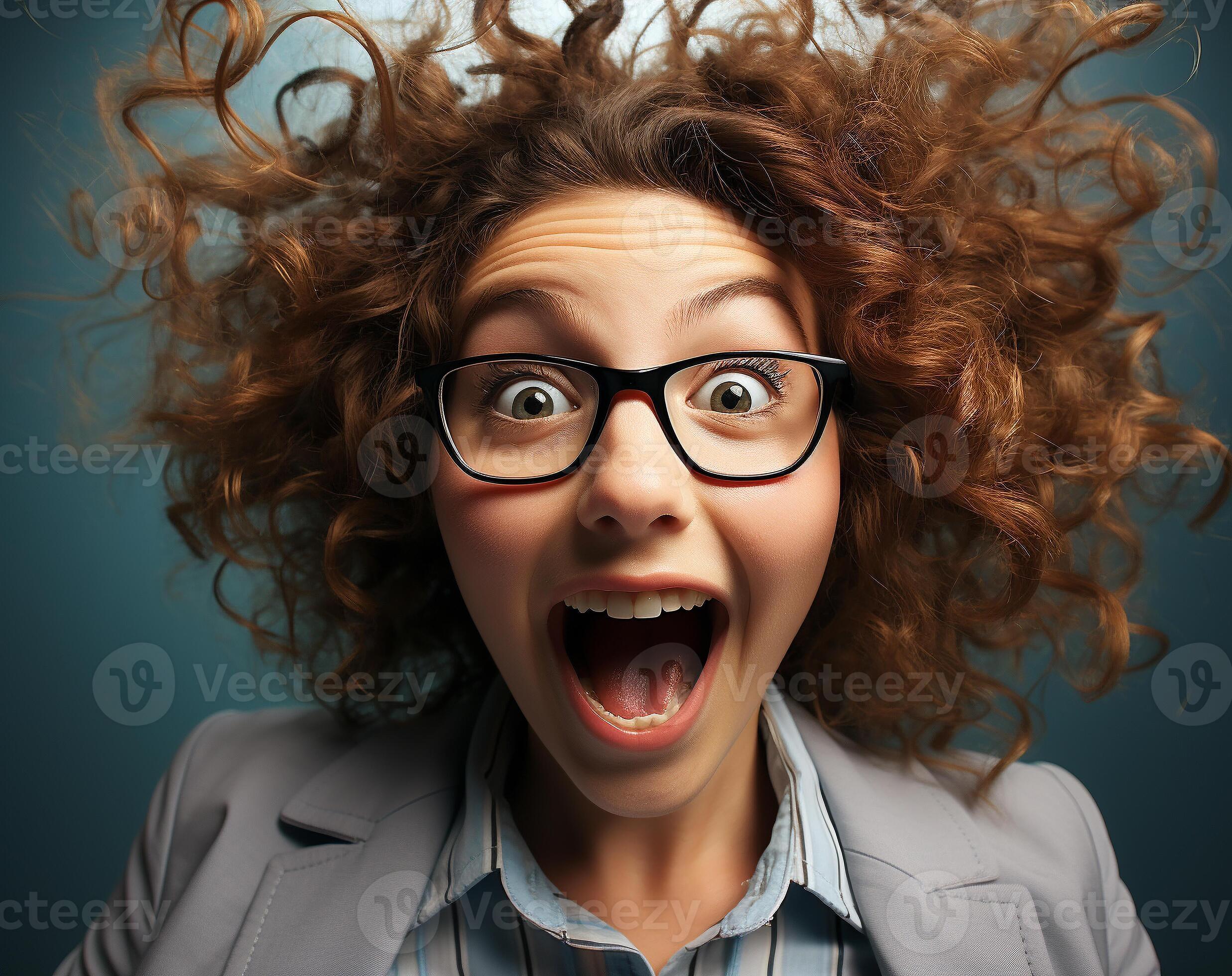 Deliriously happy and excited young girl wearing glasses smiling in her