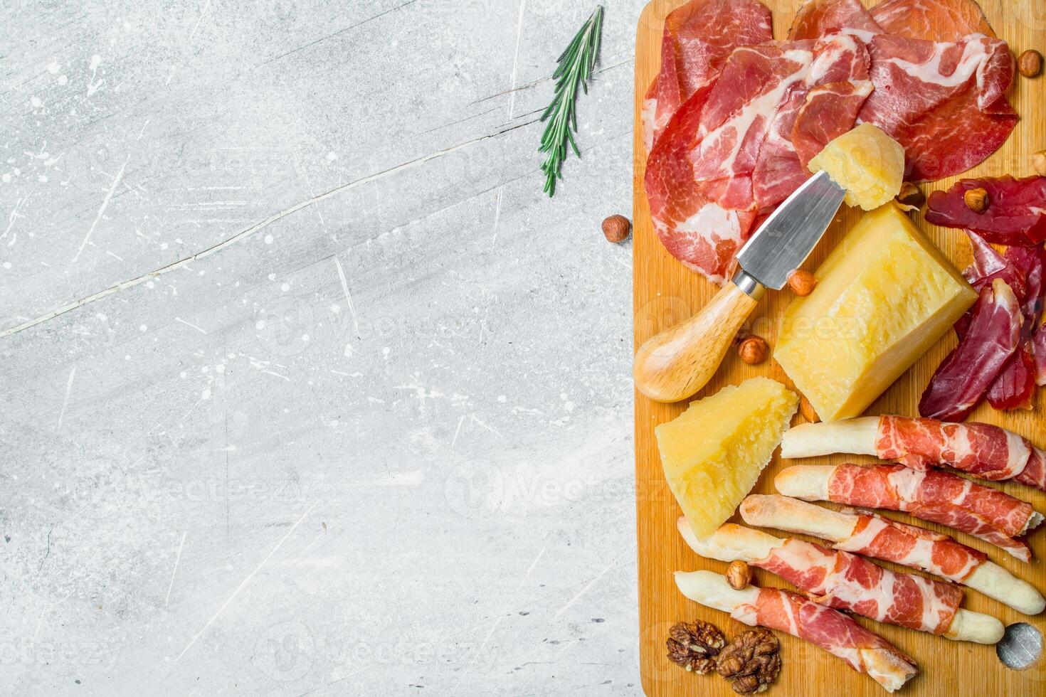 Antipasto background.Meat and cheese snacks on the Board. photo