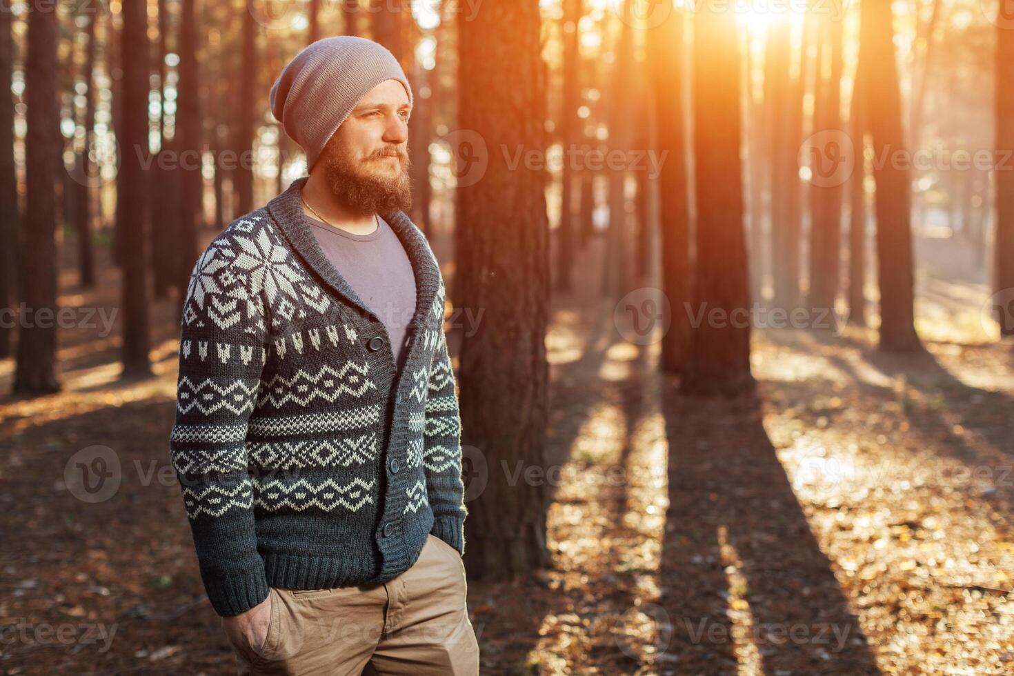 portrait of a bearded hipster tourist man in the woods forest photo