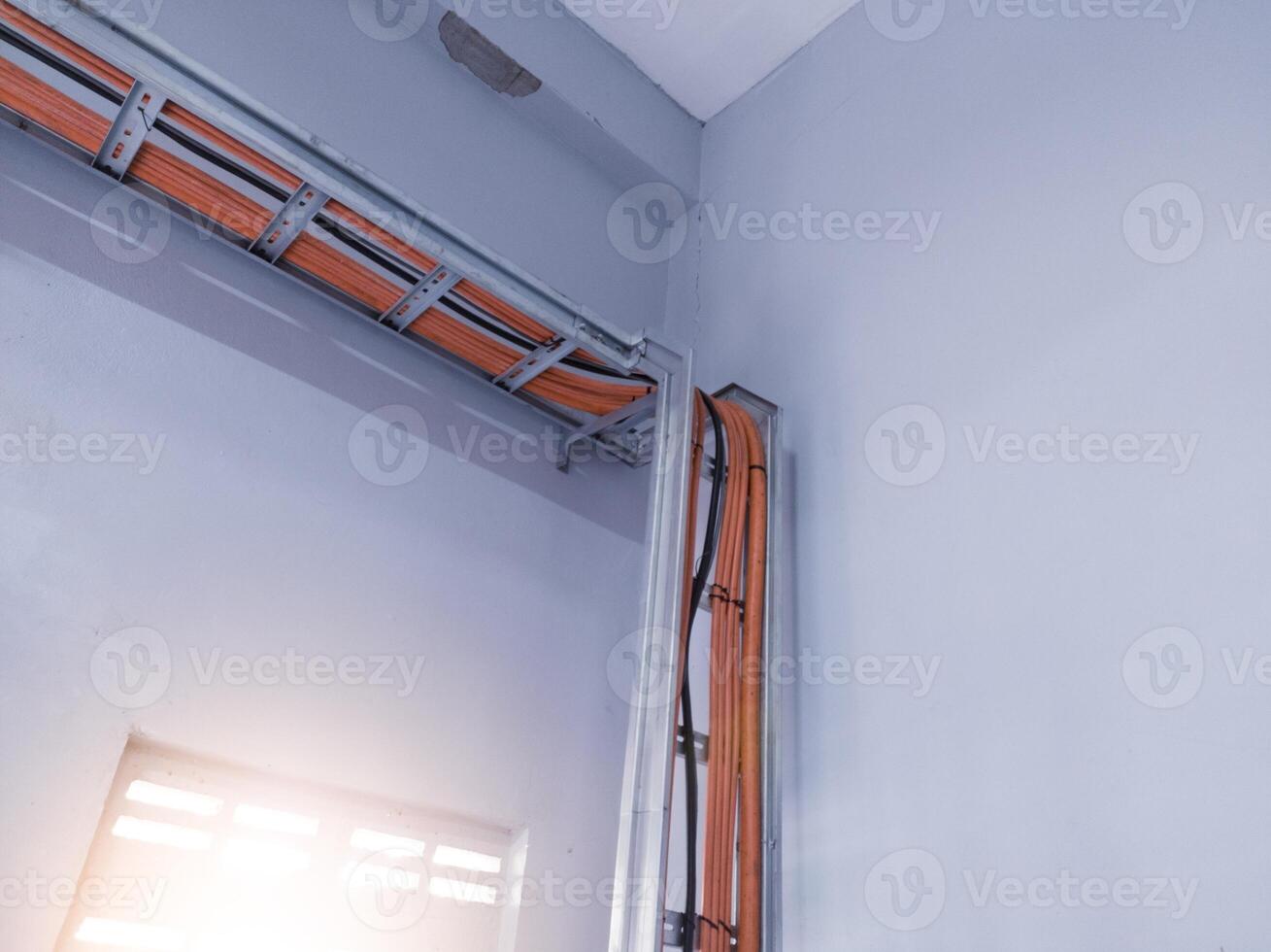 Installation cables power on the tray with spesification  fire temperature resiatance, Installation cables tray on the wall power house. power cables out inverter solar panel. photo