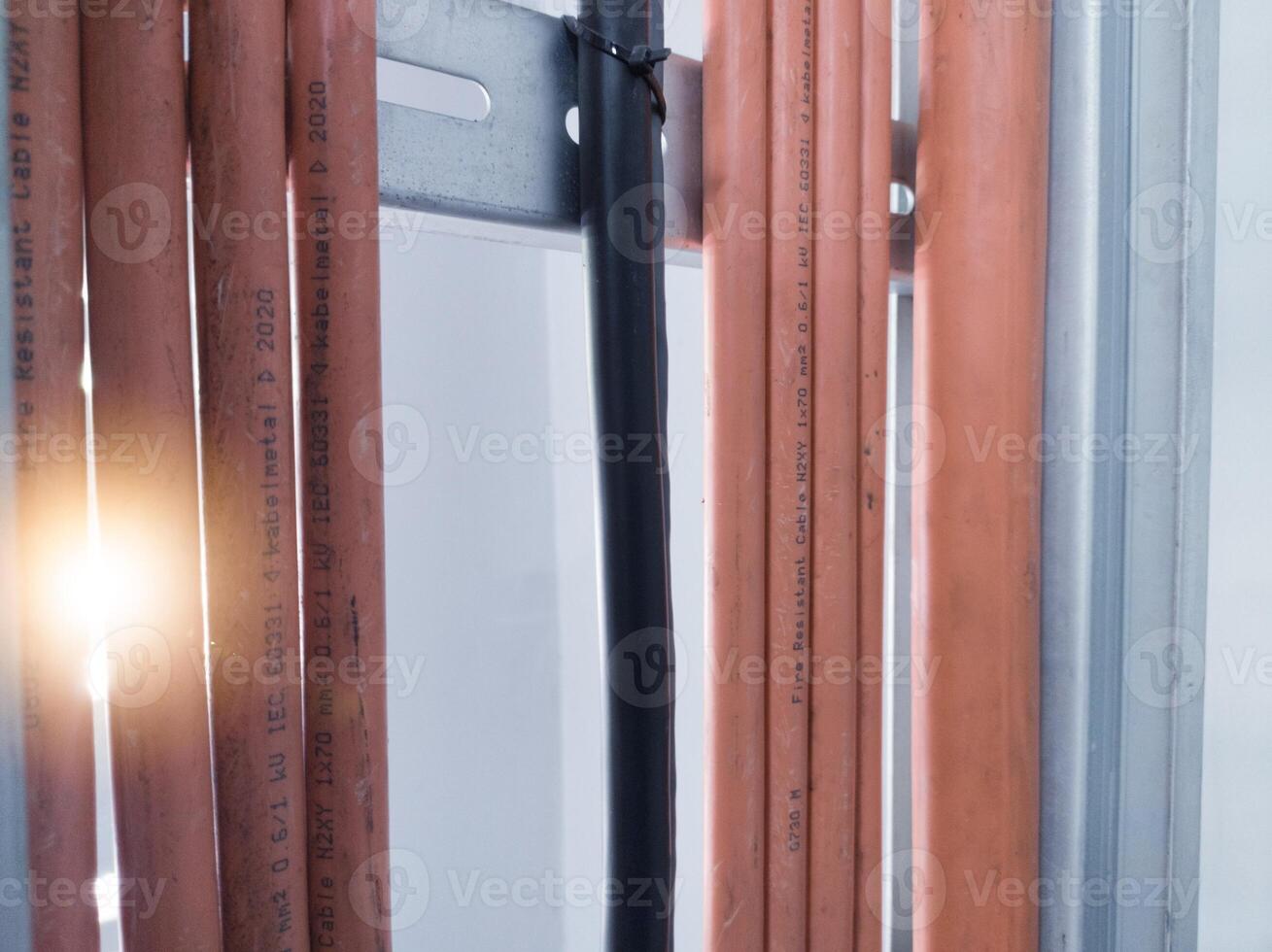 Installation cables power on the tray with spesification  fire temperature resiatance, Installation cables tray on the wall power house. power cables out inverter solar panel. photo