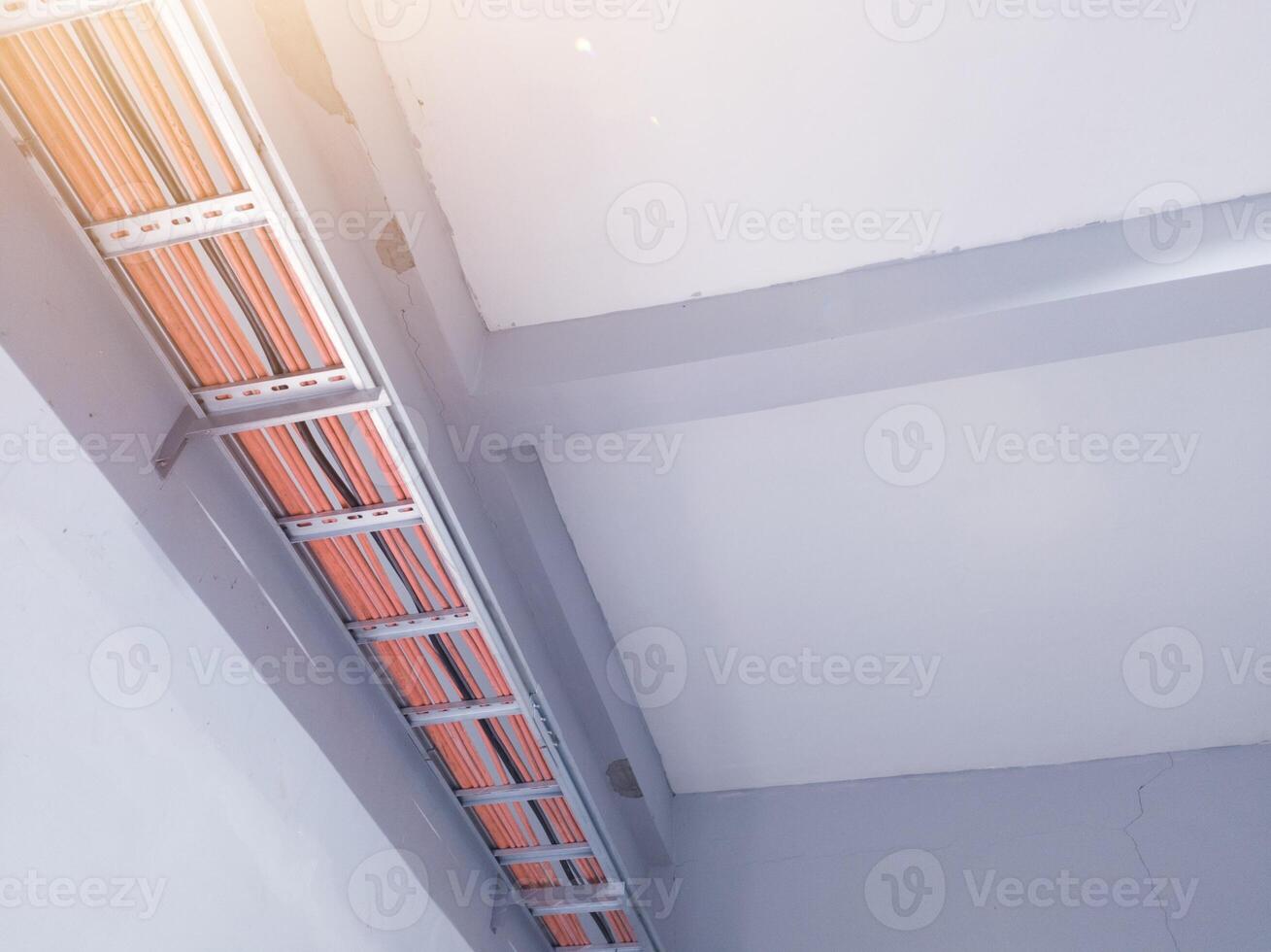 Installation cables power on the tray with spesification  fire temperature resiatance, Installation cables tray on the wall power house. power cables out inverter solar panel. photo