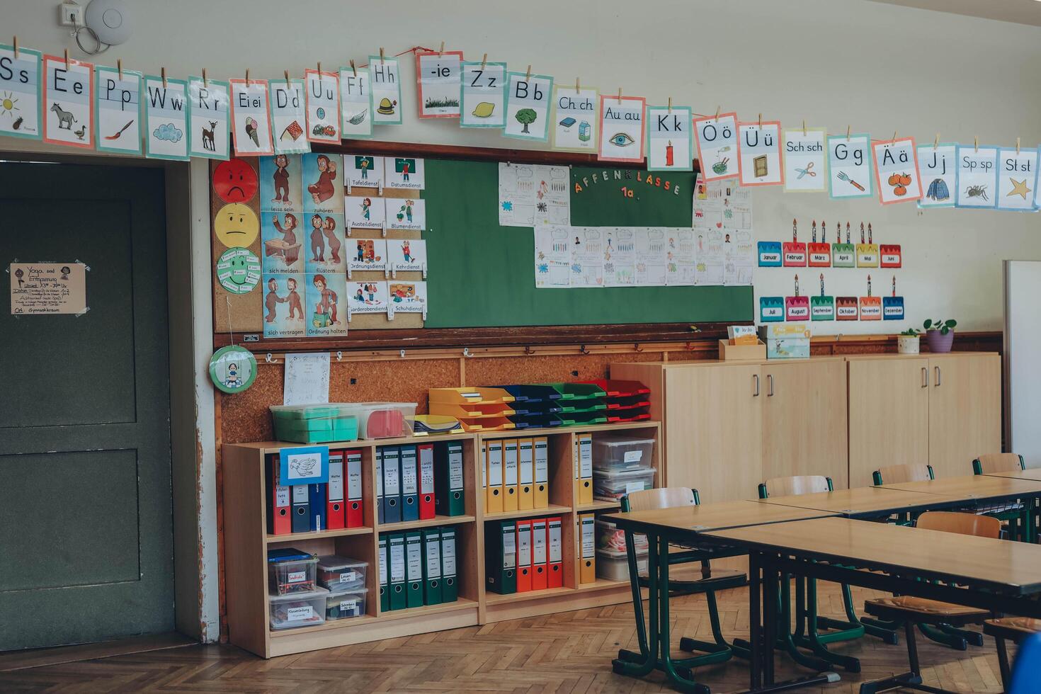 Schwabisch Gmund, Germany-November 12,2022.children's drawings hanging in the hallway of a German school. photo