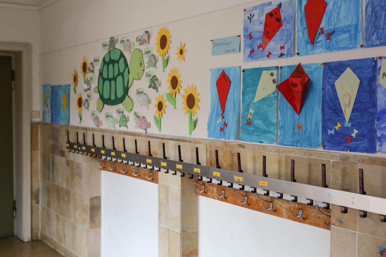 Schwabisch Gmund, Germany-November 12,2022.children's drawings hanging in the hallway of a German school. photo
