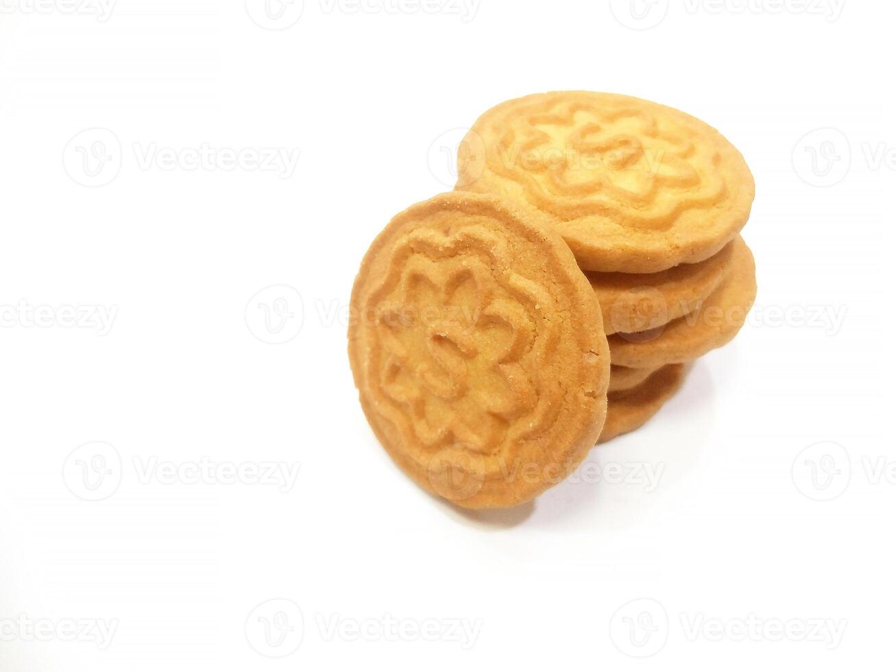 Wheat biscuits BISCUITS - A stack of delicious wheat round biscuits with a few crumbs isolated on white photo