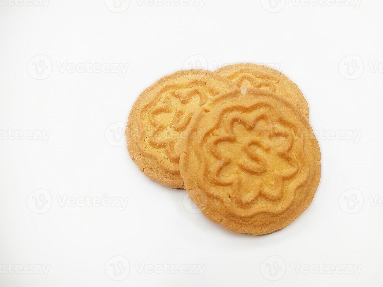 Wheat biscuits BISCUITS - A stack of delicious wheat round biscuits with a few crumbs isolated on white photo