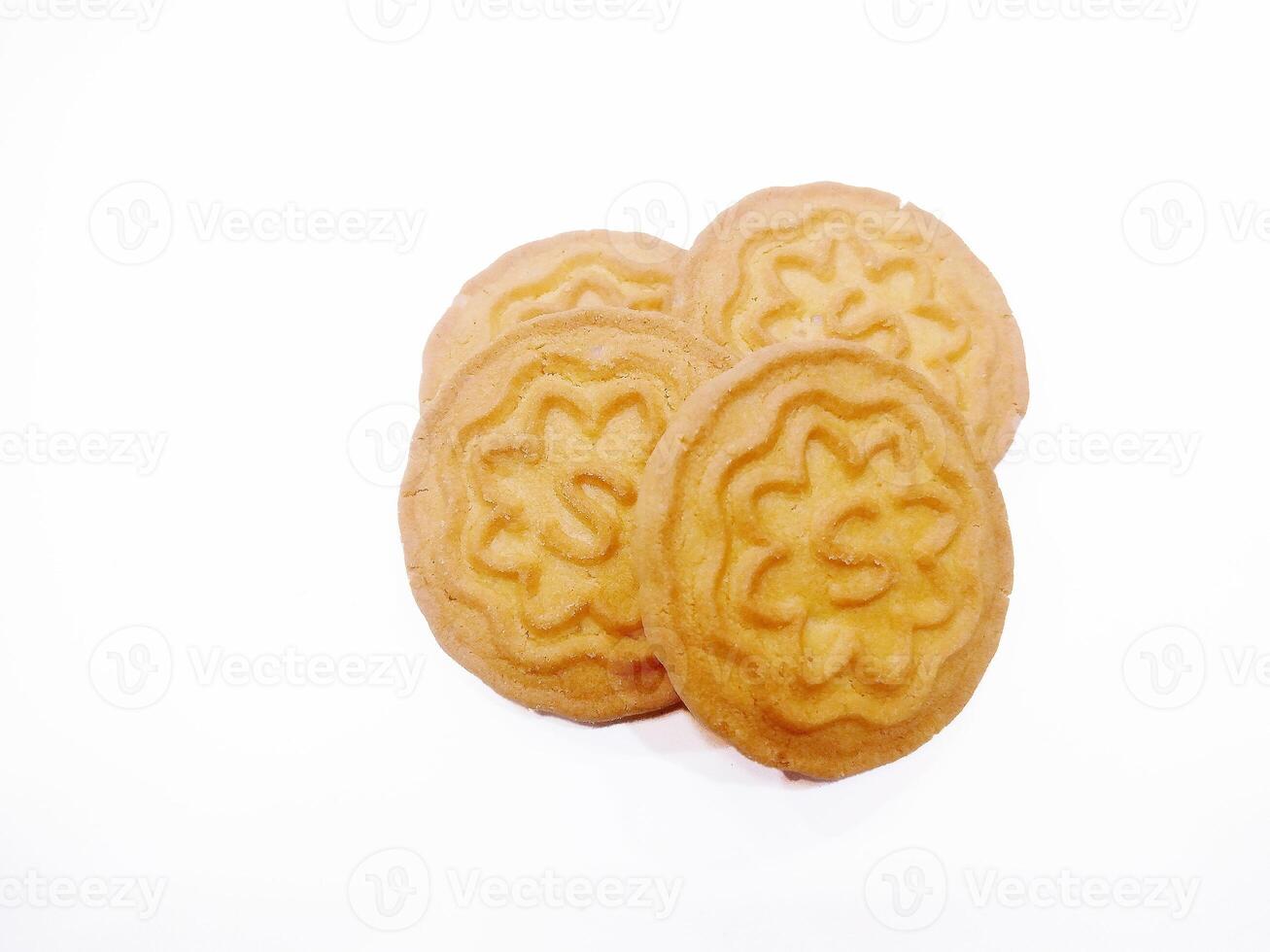 Wheat biscuits BISCUITS - A stack of delicious wheat round biscuits with a few crumbs isolated on white photo