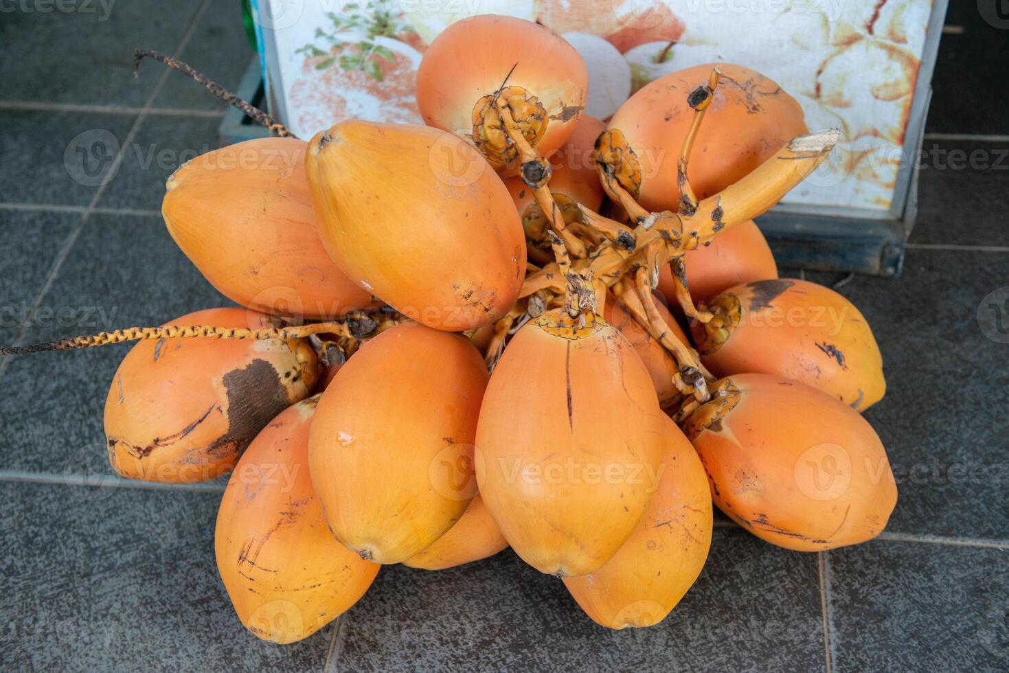 Group of king coconut known as Thembili in local market of Sri Lanka. photo