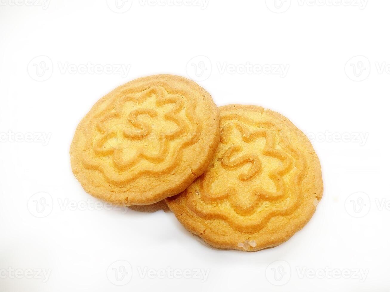 Wheat biscuits BISCUITS - A stack of delicious wheat round biscuits with a few crumbs isolated on white photo