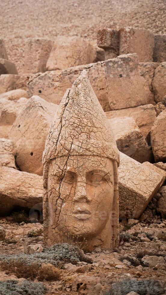 Antique ruined statues on Nemrut mountain in Turkey. ancient Kingdom of Commagene in south east Turkey. photo