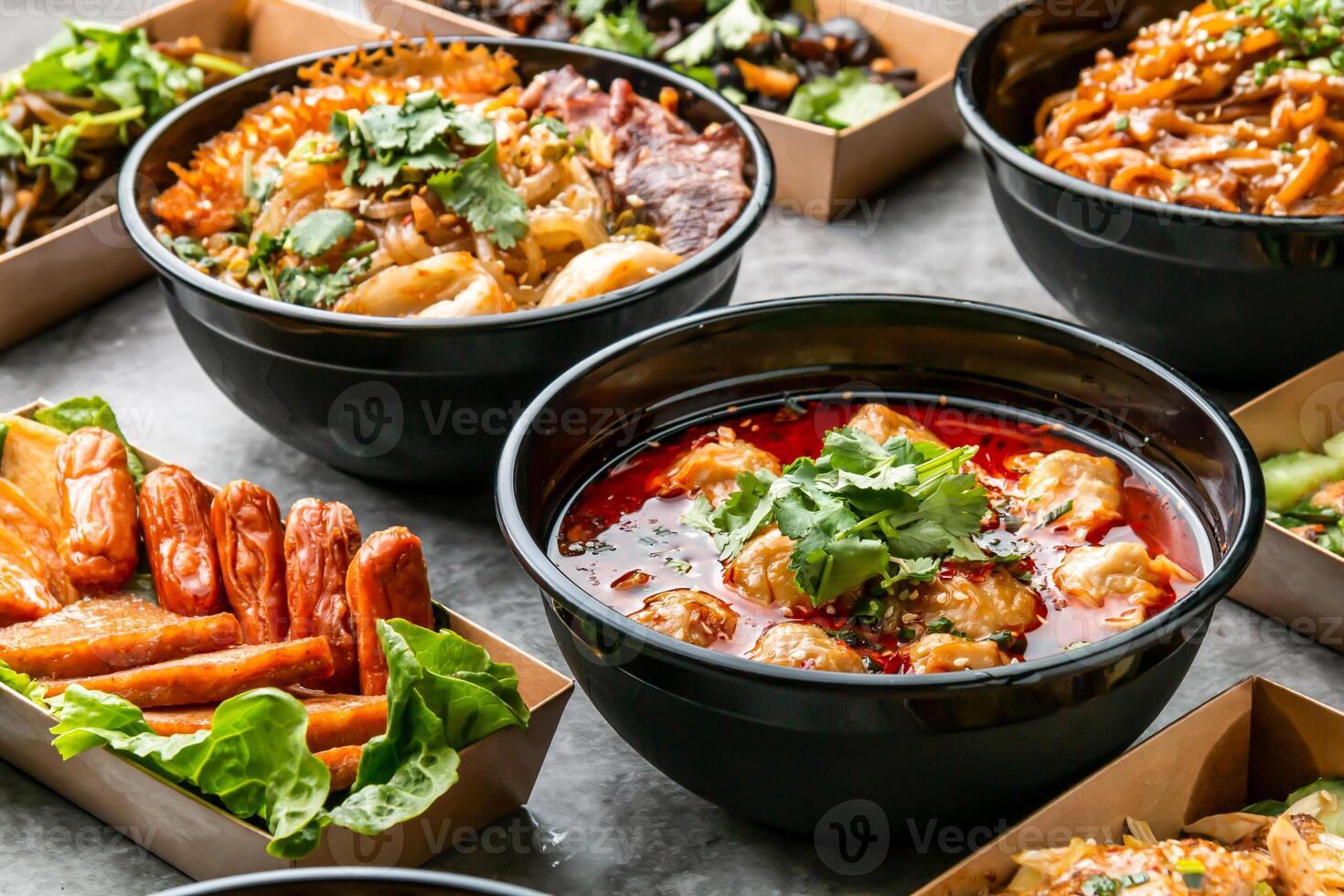 Chongqing Spicy Wonton Soup, Kelp salad, Cold cloud fungus, Bashu shredded chicken, cold noodles, Cucumber with sesame sauce served in dish isolated on wooden table side view of hong kong fast food photo