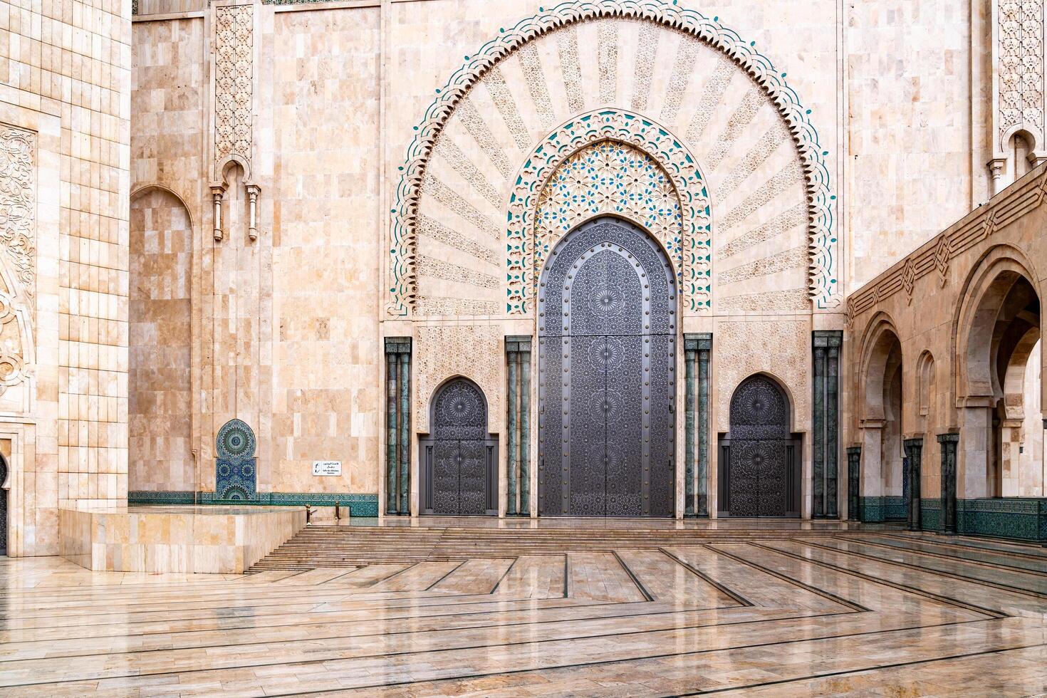 Casablanca, Morocco -march 25, 2024-The great portals of the Hassan II Mosque in Casablanca during a rainy day photo