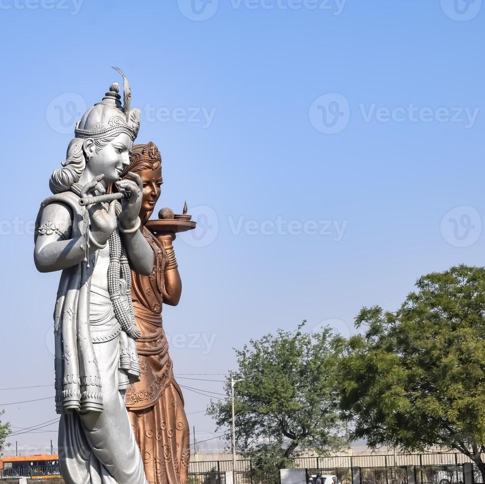 Big statue of Lord Radha Krishna near Delhi International airport, Delhi, India, Lord Krishna and Radha big statue touching sky at main highway Mahipalpur, Delhi photo