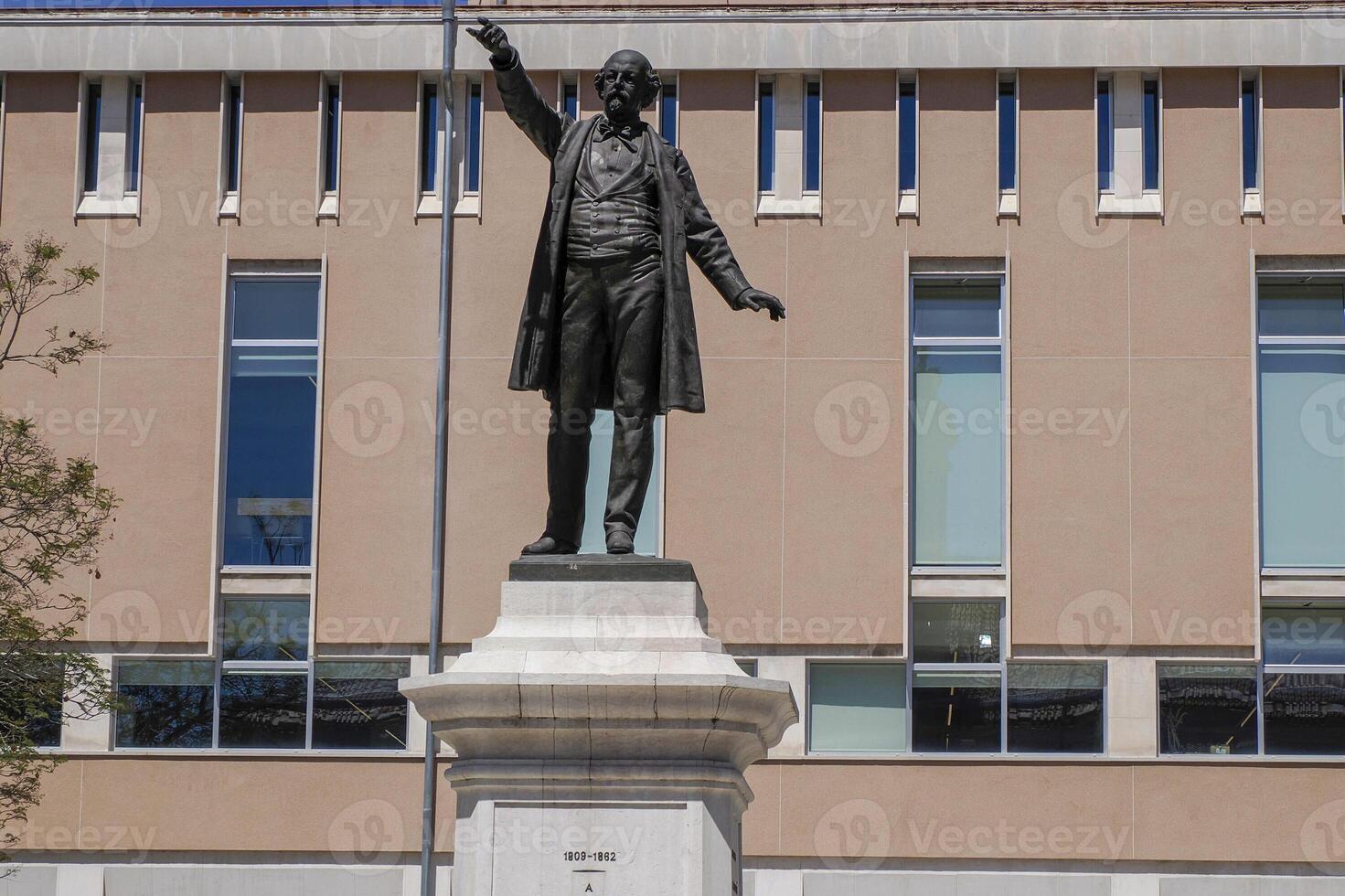 sculpture of Jose Estevao Coelho de Magalhaes in Aveiro pictoresque village street view, The Venice Of Portugal photo