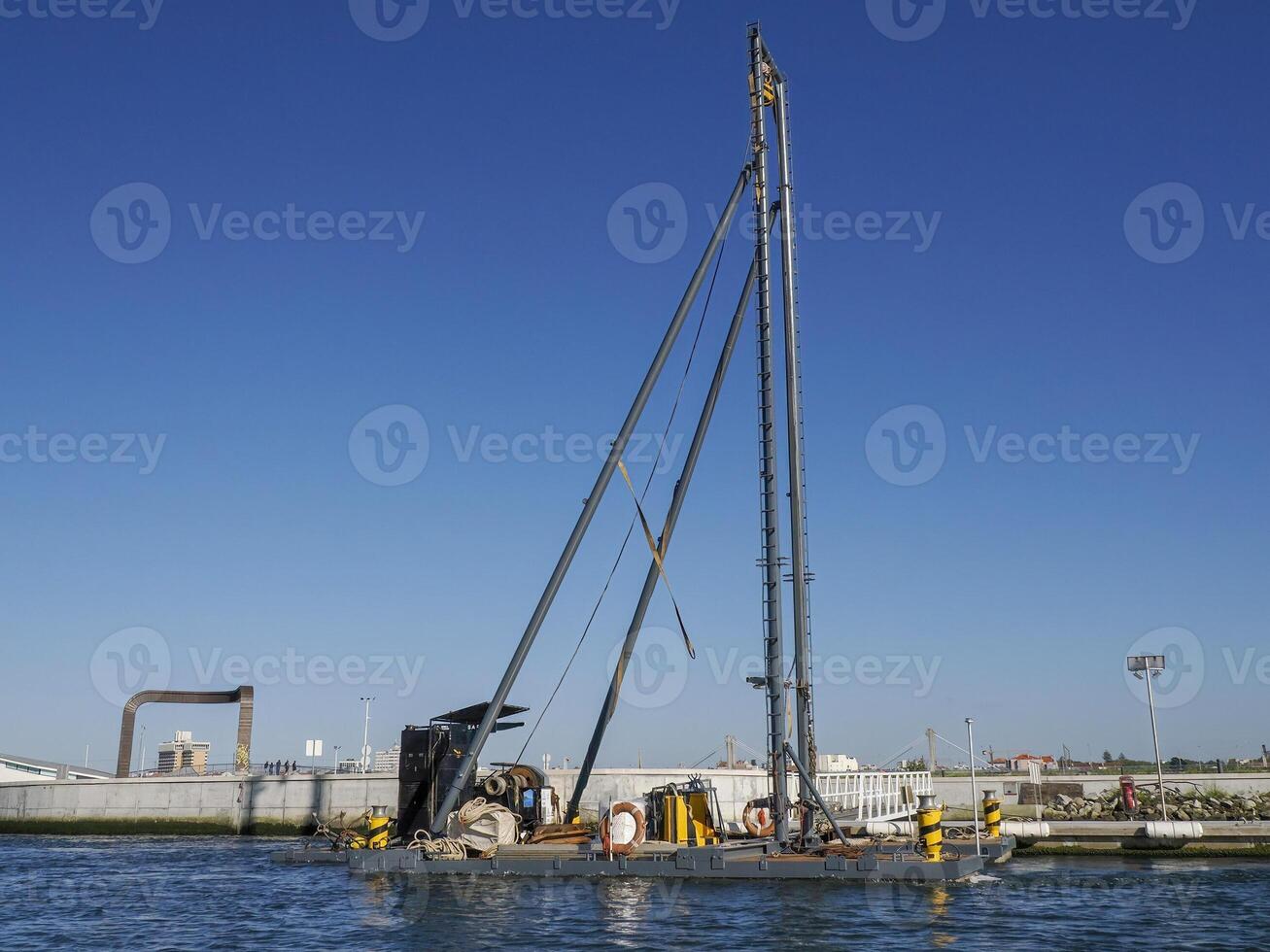dredge of saline in salt ponds of Aveiro pictoresque village street view, The Venice Of Portugal photo