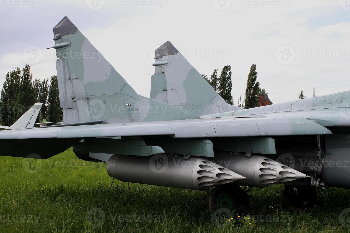 Rocket launcher system under the wing of military fighter photo