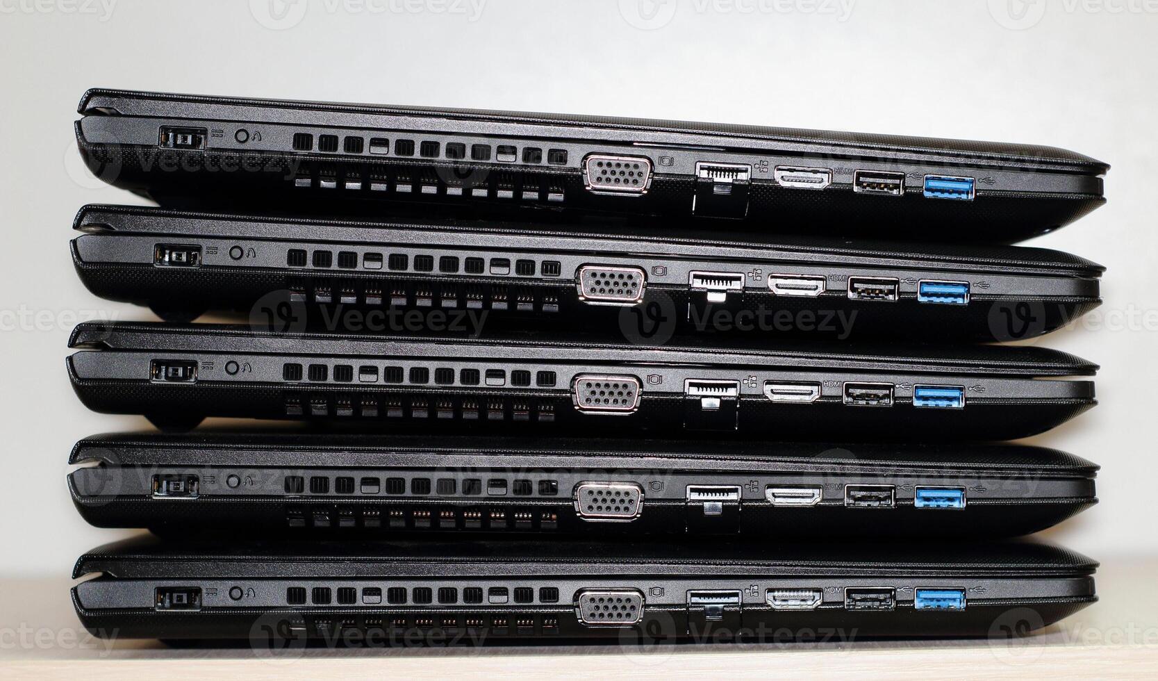 Folded Stack Of Laptops Studio Isolated On White Background photo
