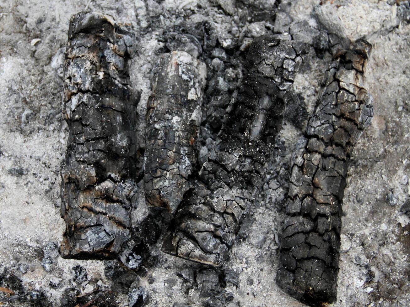 Extinct embers of bonfire macro shot stock photo