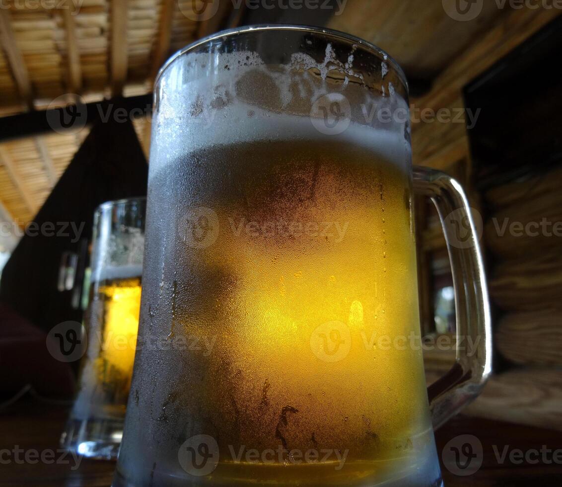 Full glasses of beer on the bar desk at country style bar photo