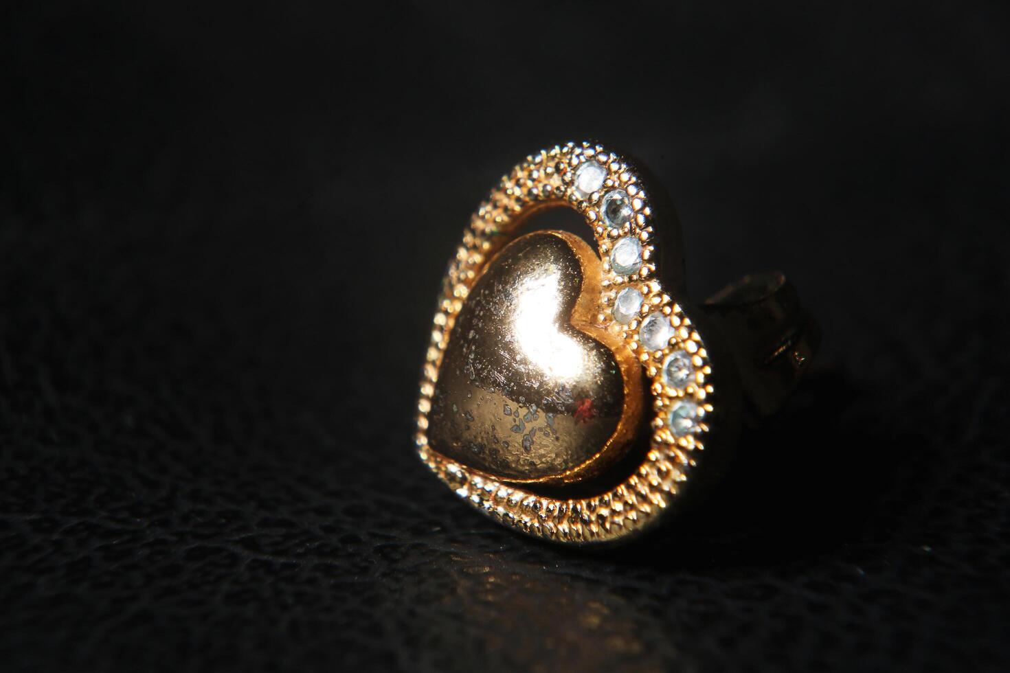 Colse up of an earring with false diamonds photo