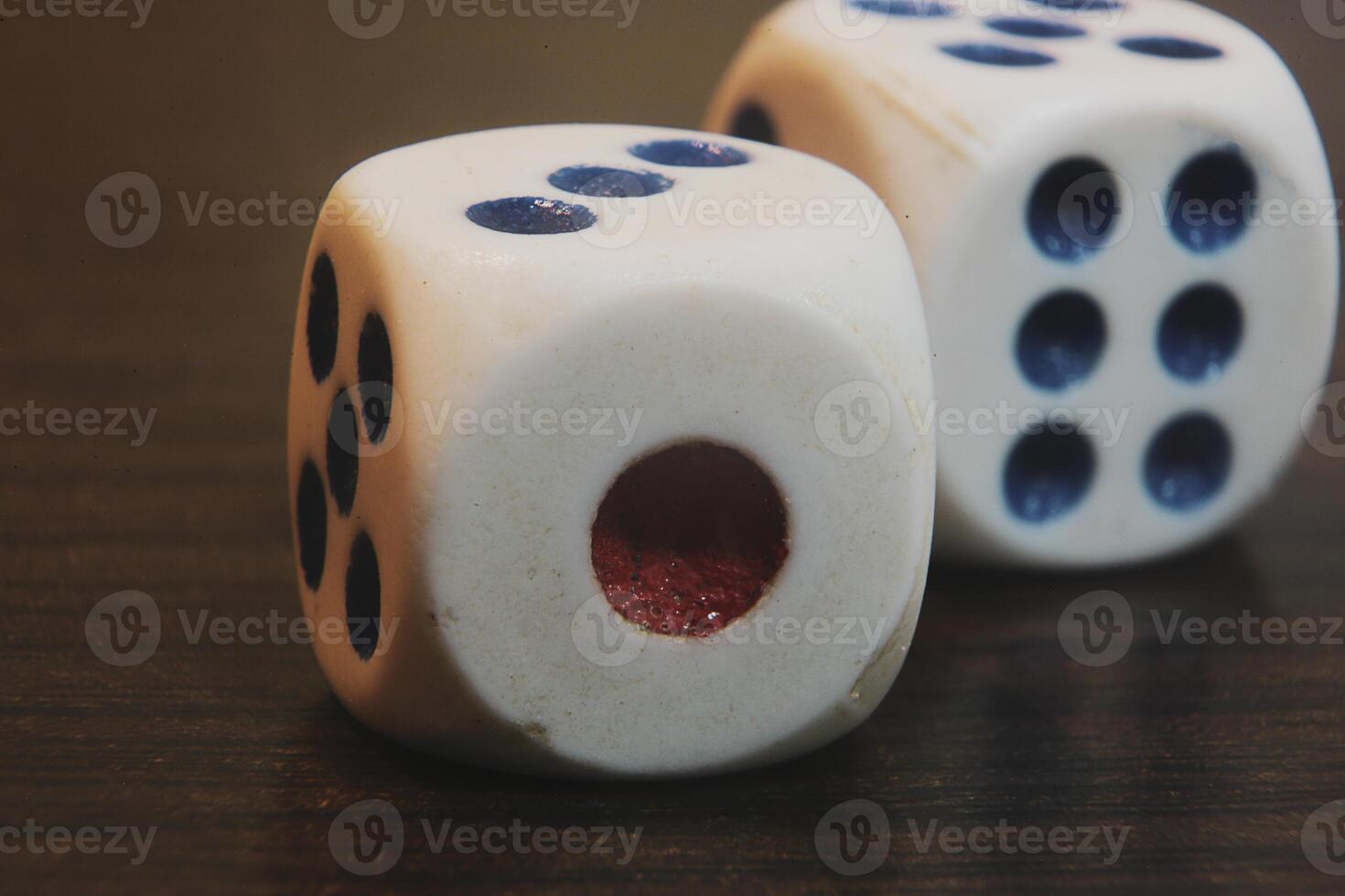 Close up of two dice on a wooden table photo