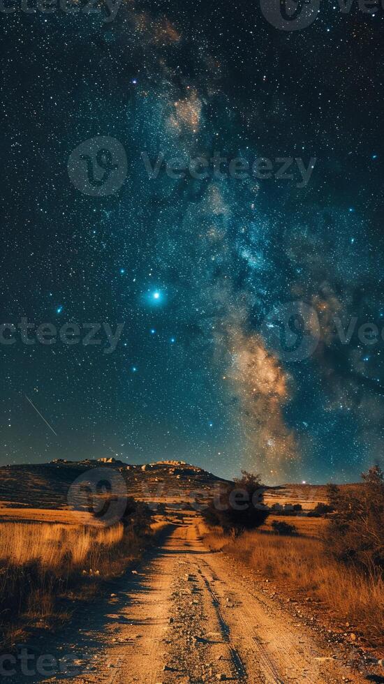Stars trailing in the night sky over a silent desert photo