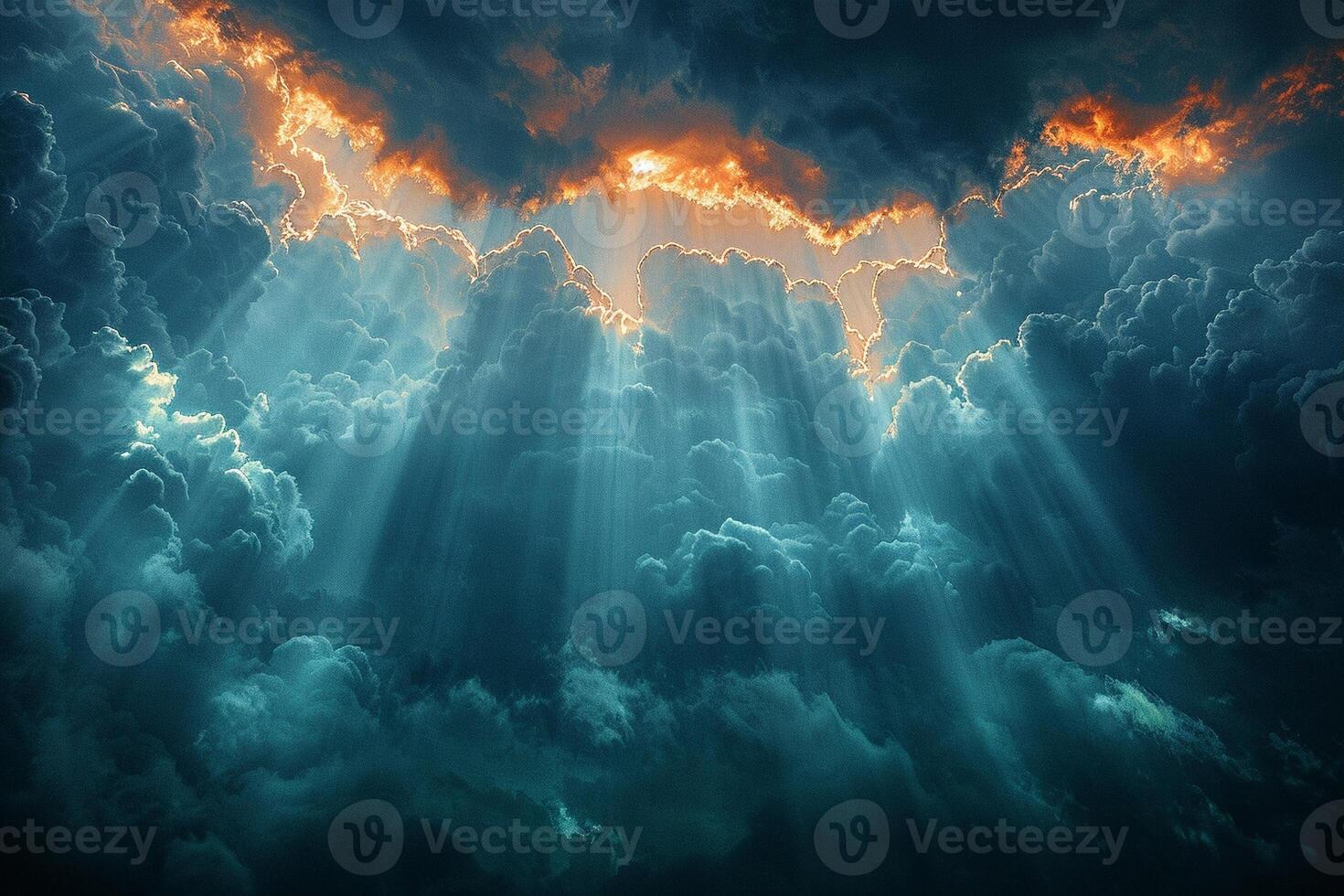 Sunbeams breaking through dark clouds after a storm photo