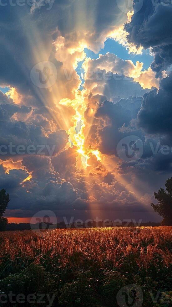 Sunbeams through heavy rain clouds photo