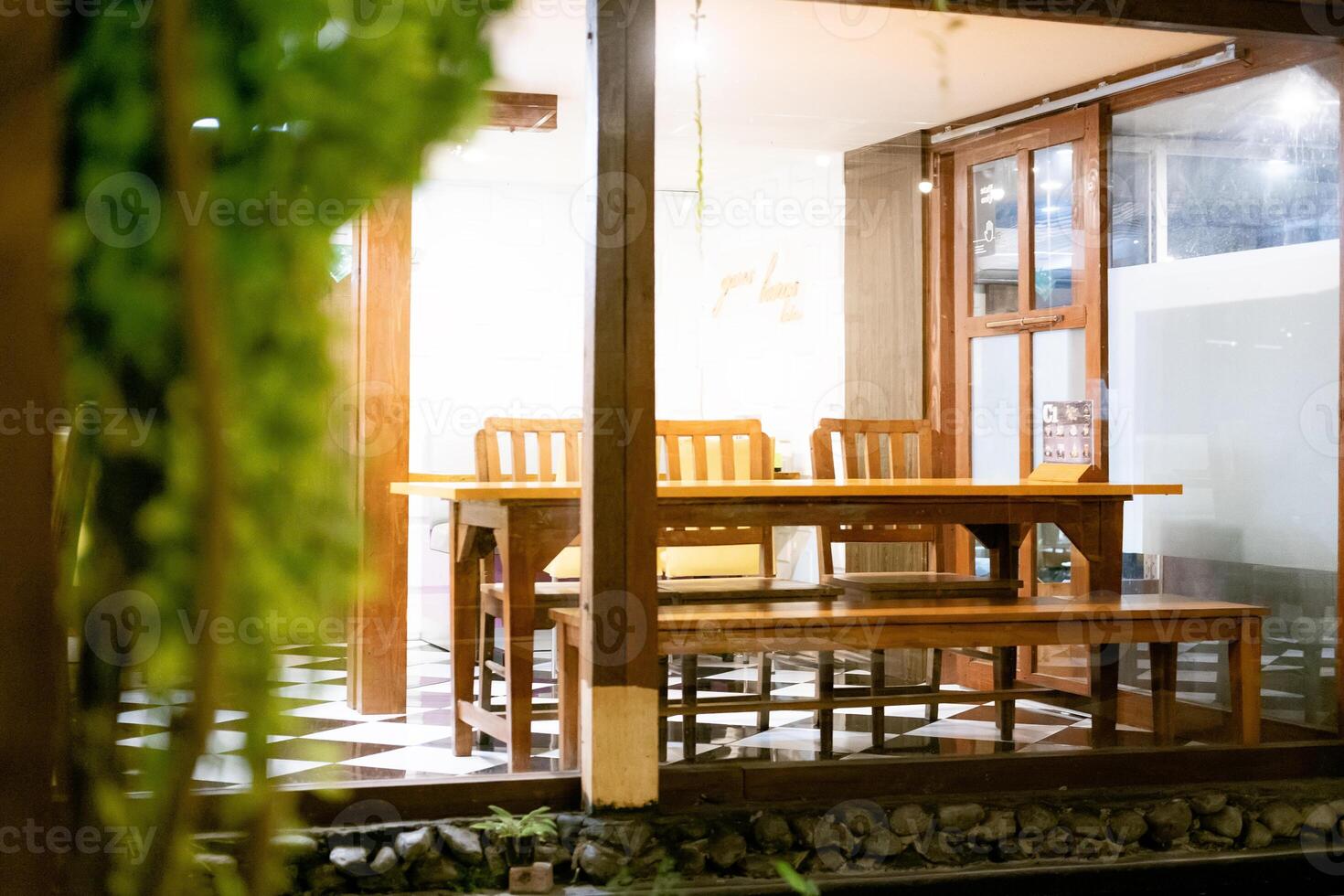 Selective Focus and blur on Climbing Plants and Wooden Cafe Table Set as Commercial Background photo